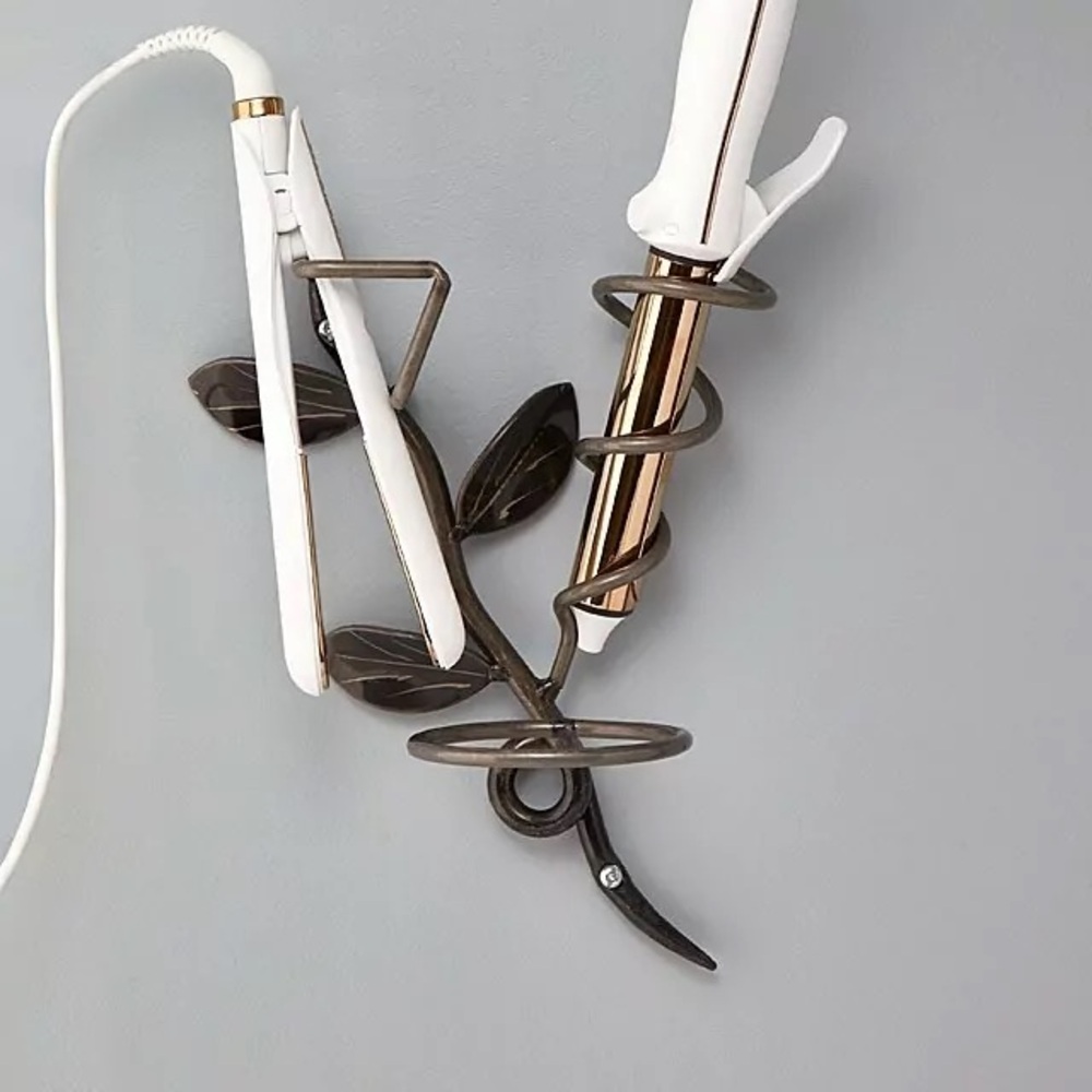 Michael McNeil’s decorative wall hair tools holder.  Unique and beautiful too!